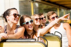 teens enjoying a bus tour